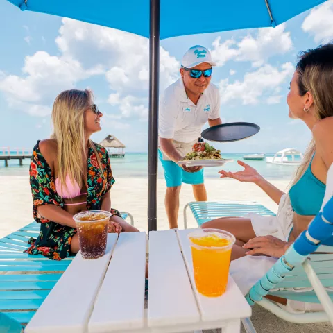 Beach lounge chair dining drinks Cozumel