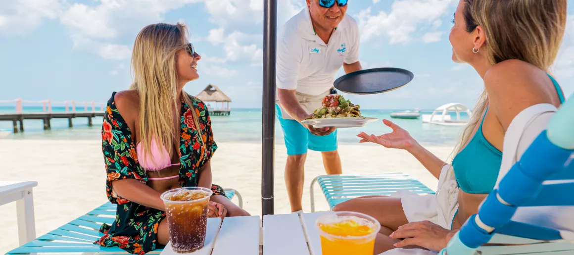 Beach lounge chair dining drinks Cozumel