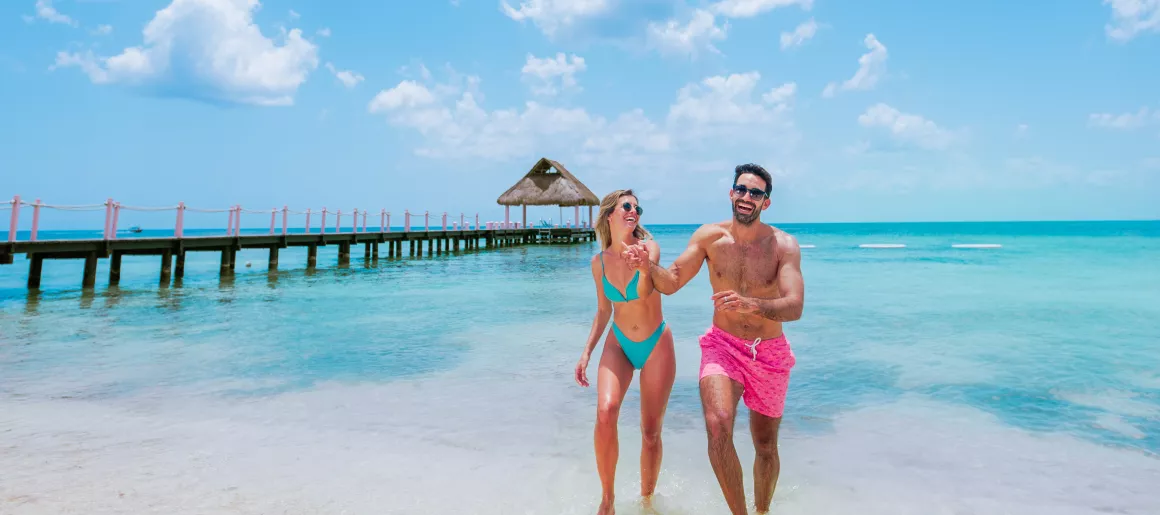 Couple walking beach Cozumel all inclusive beach club
